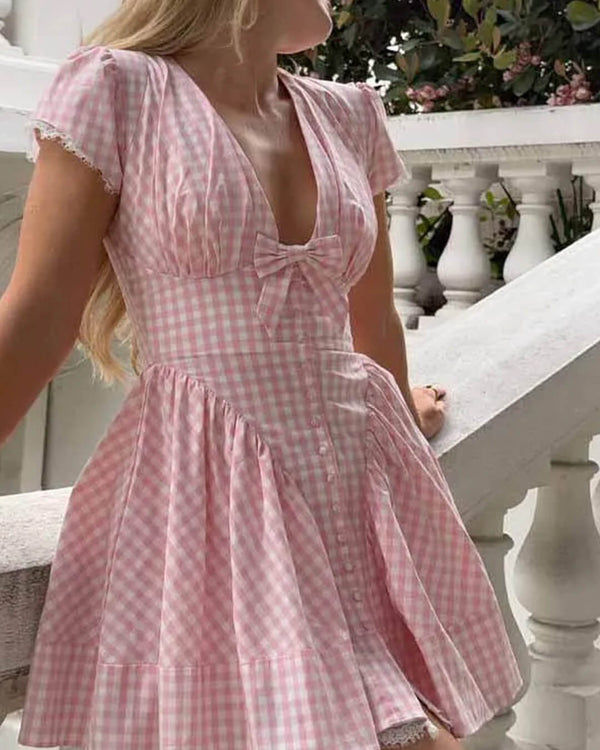 Mini-robe à col en V et nœud Mia