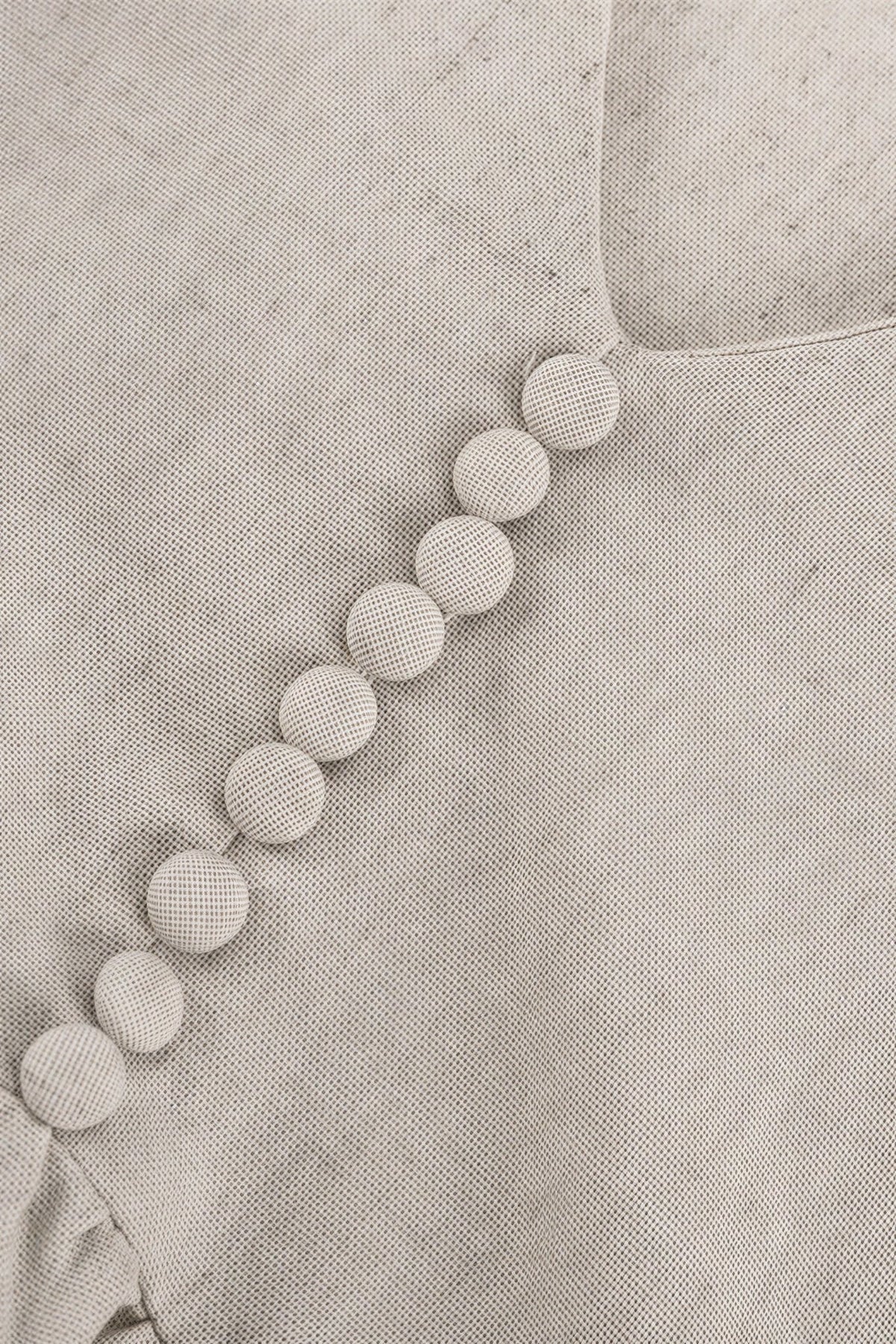 Mini-robe Femke à encolure en V et manches bouffantes