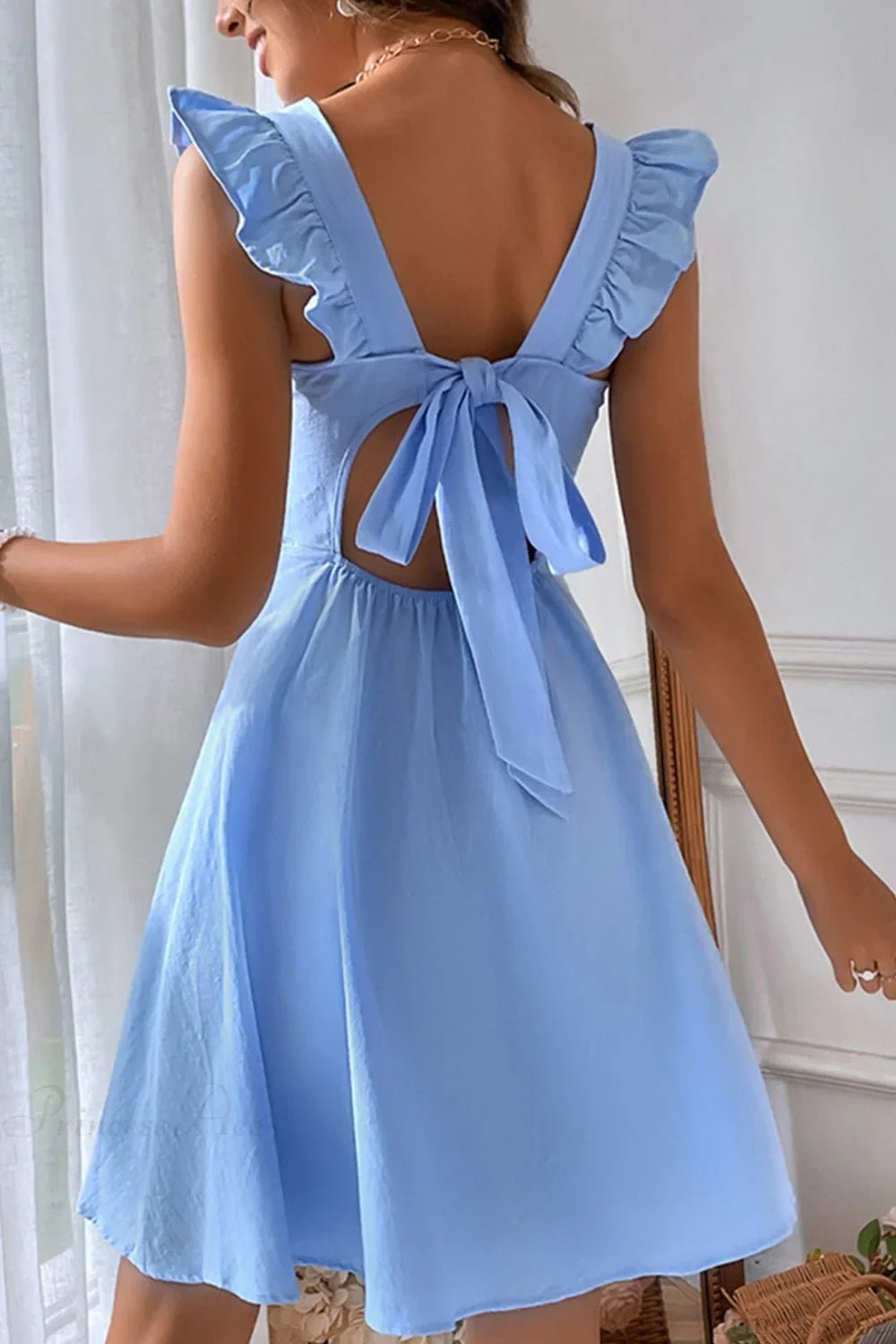 Robe courte sans manches Nora avec lien à nouer au dos et volants