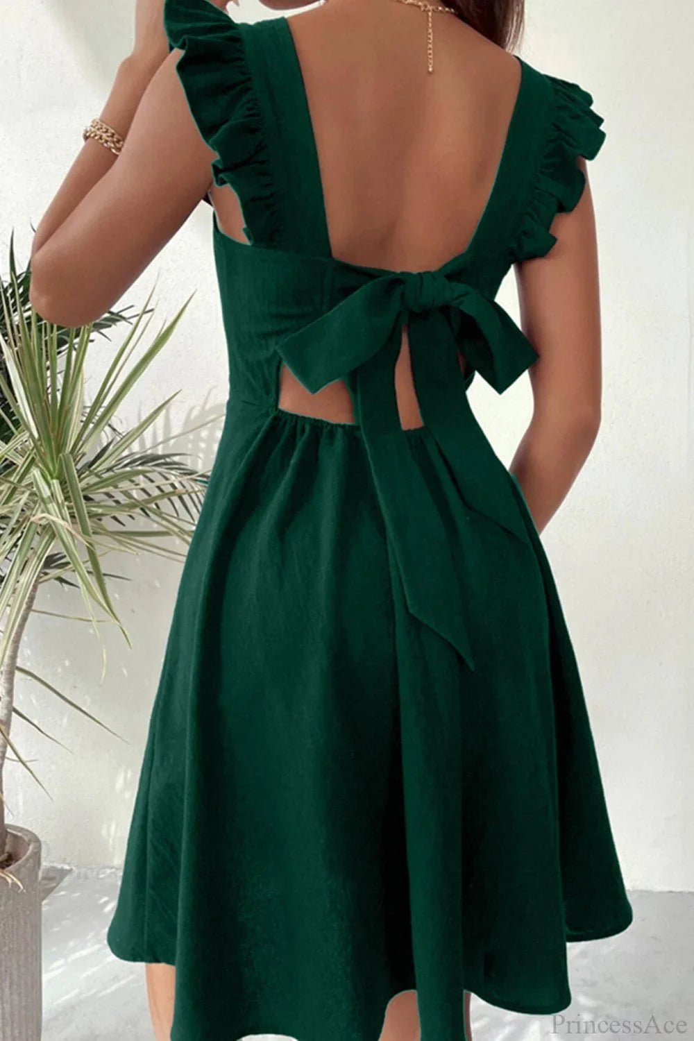 Robe courte sans manches Nora avec lien à nouer au dos et volants