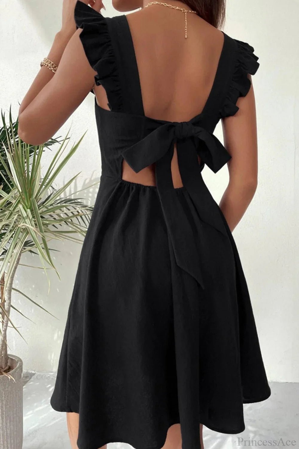 Robe courte sans manches Nora avec lien à nouer au dos et volants